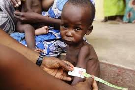 Nigerians eating local foods while health experts warn about food safety and preventable diseases