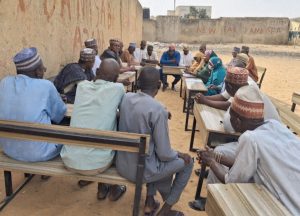 Nigerians eating local foods while health experts warn about food safety and preventable diseases