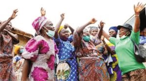 Nigerians eating local foods while health experts warn about food safety and preventable diseases