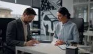 Business partners discussing product quantity before signing a contract.