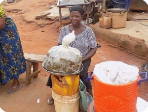 Nigerians eating local foods while health experts warn about food safety and preventable diseases