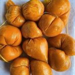 Nigerians eating local foods while health experts warn about food safety and preventable diseases