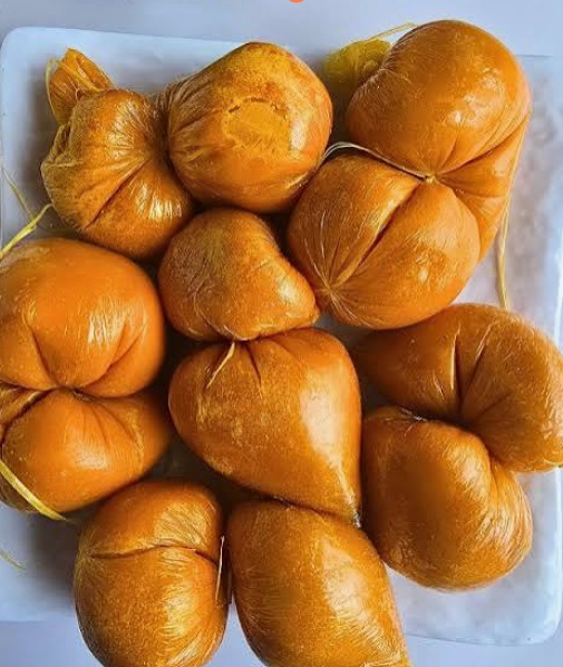 Nigerians eating local foods while health experts warn about food safety and preventable diseases